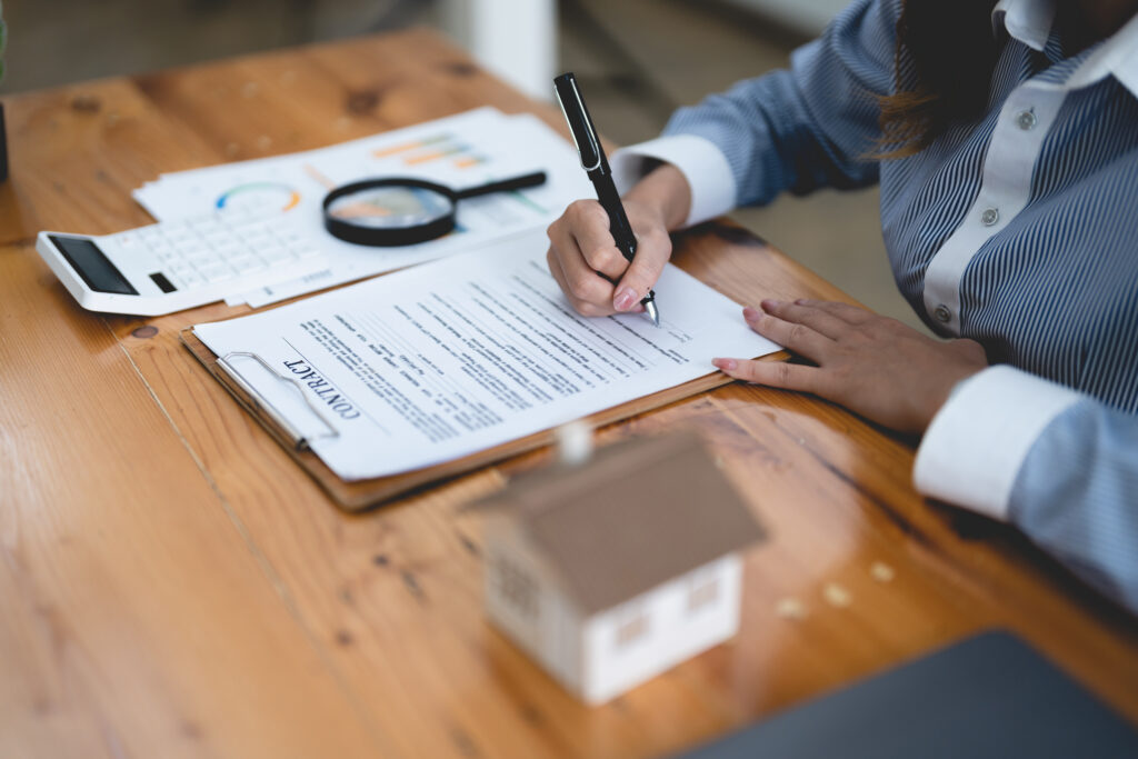 woman signing rental contract at meeting with real 2022 09 06 04 30 53 utc